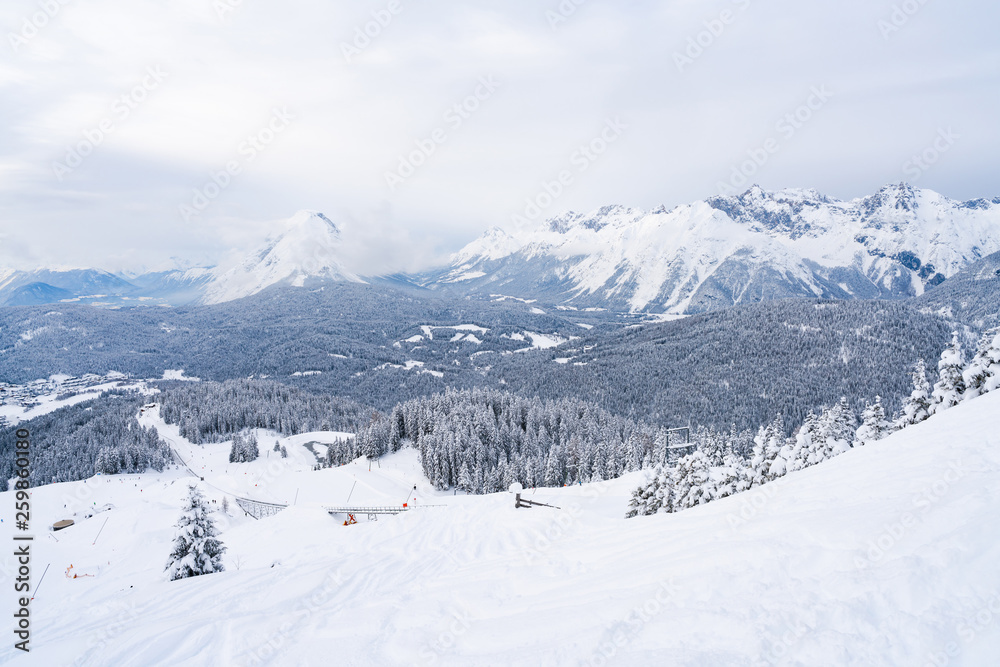 Winter landscape with snow covered Alps and ski slopes in Seefeld in the Austrian state of Tyrol. Winter in Austria Winter landscape with snow covered Alps and ski slopes in Seefeld in the Austrian state of Tyrol. Winter in Austria