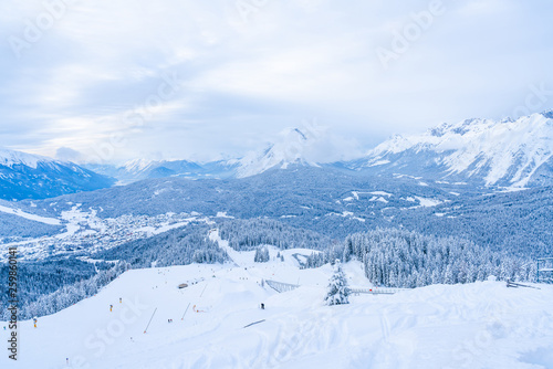 Winter landscape with snow covered Alps, ski slopes and aerial view of Seefeld in the Austrian state of Tyrol. Winter in Austria