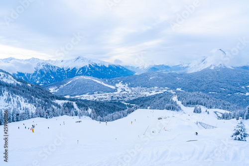 Winter landscape with snow covered Alps, ski slopes and aerial view of Seefeld in the Austrian state of Tyrol. Winter in Austria