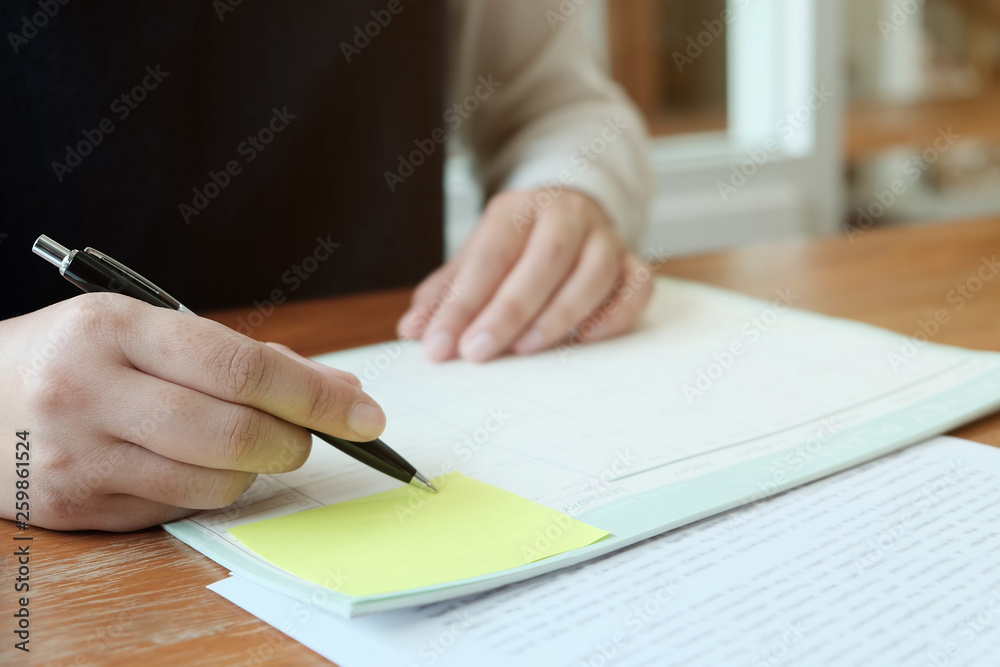 Business People Meeting Design Ideas with pen analyzing financial documents professional investor working new start up project. Concept. business planning in office. Business People Meeting Design Ideas with pen analyzing financial documents professional investor working new start up project. Concept. business planning in office.