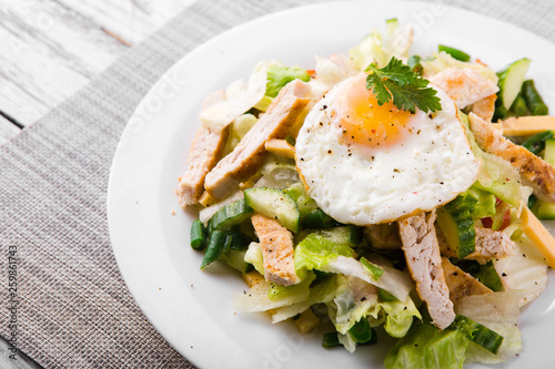 dietary salad with chicken breast, green beans, cucumber and egg