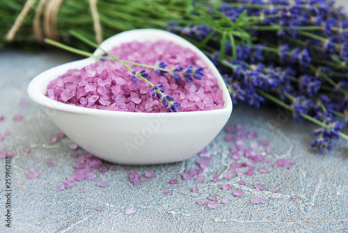 Heart-shaped bowl with sea salt and fresh lavender flowers