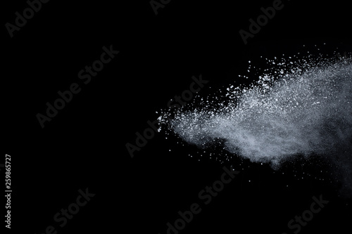 abstract powder splatted background,Freeze motion of color powder exploding throwing color powder,color glitter texture on black background.