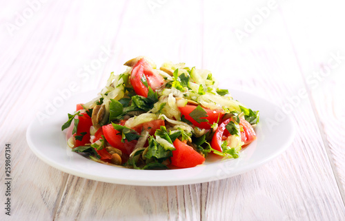 Fresh vegetable salad with cucumber, tomato