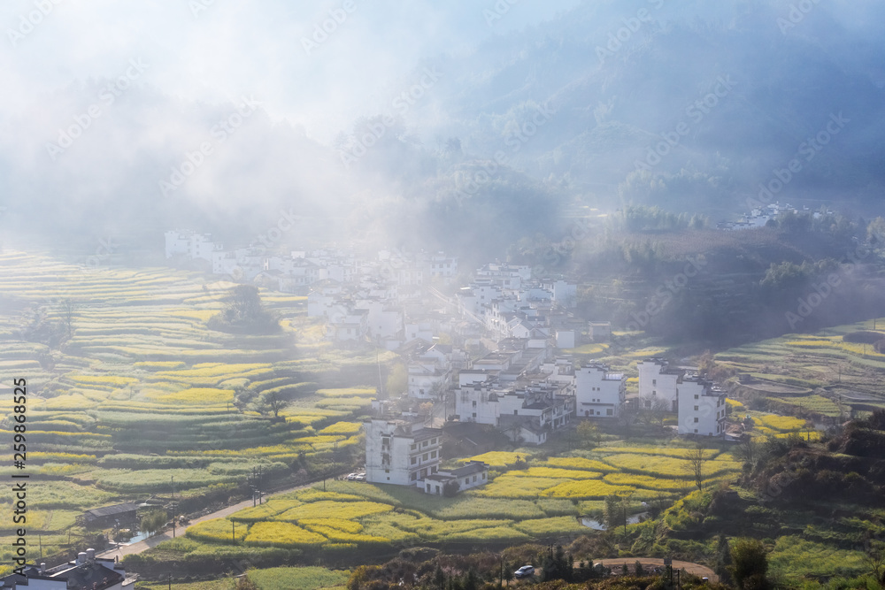 beautiful wuyuan mountain village in morning mist