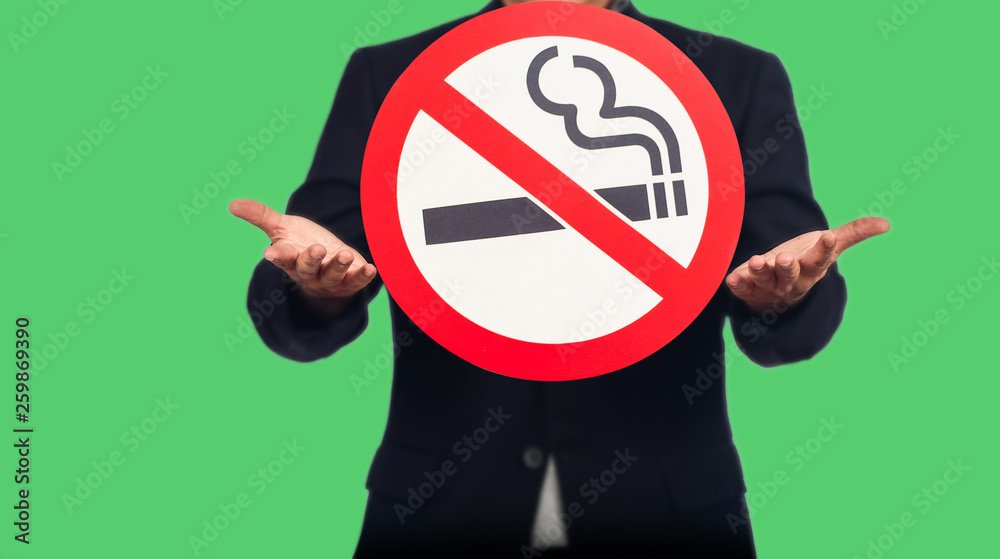 Business man show with no smoking sign ,health concept.
