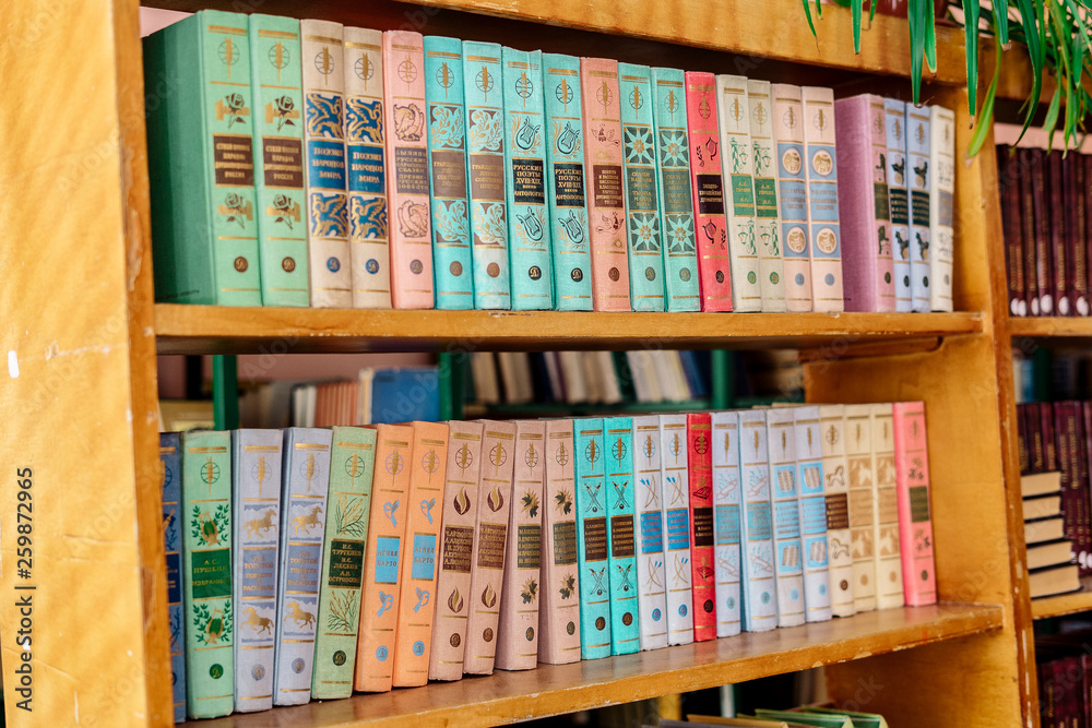 Stack of hardback books on wooden table. Back to school. Copy space Stack of hardback books on wooden table. Back to school. Copy space