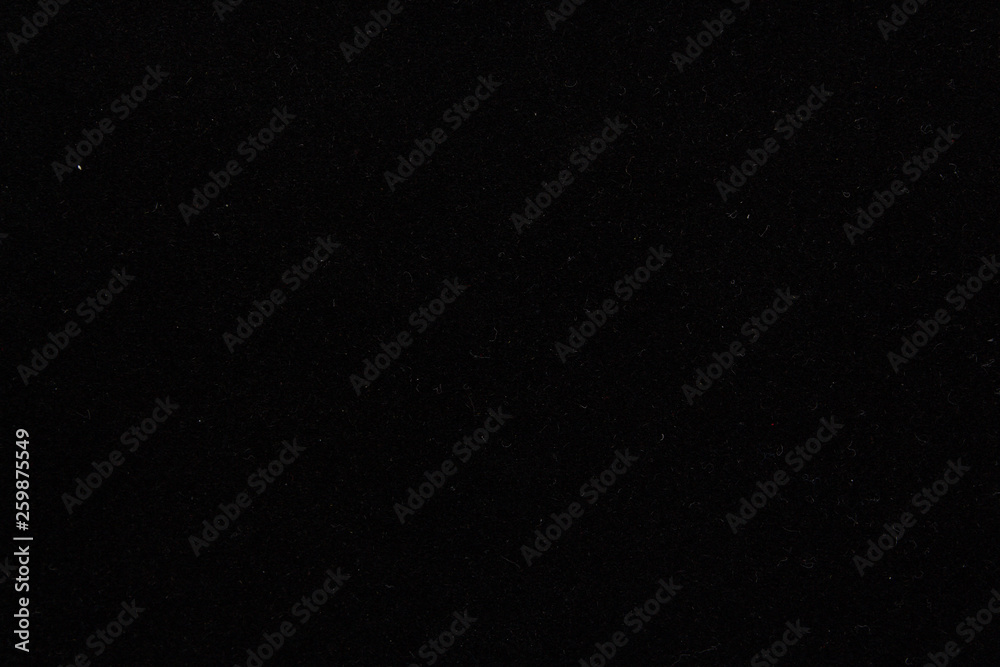 Fototapeta premium Black background, velvet paper texture, top view