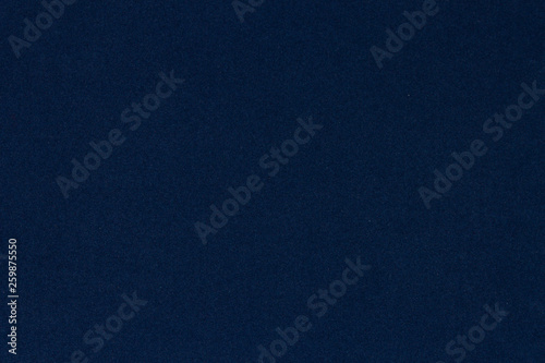 Blue background, velvet paper texture, top view