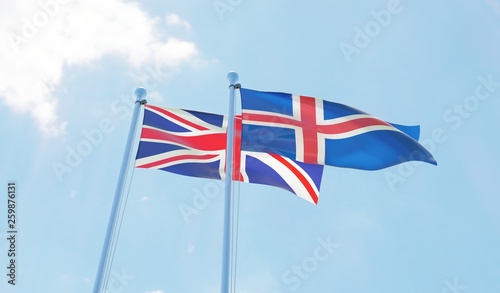 UK and Iceland, two flags waving against blue sky. 3d image