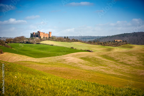 View of Castle of Gallico. Beautiful landscape of hills and fields near Asciano in Tuscany, Siena, Italy photo