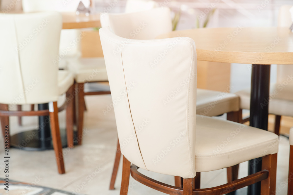 White chairs with wooden structure in interior restaurant
