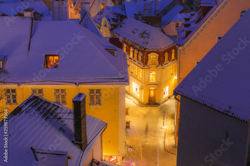 Rooftop view of old town of Tallinn  Estonia. Snowy night fairytale