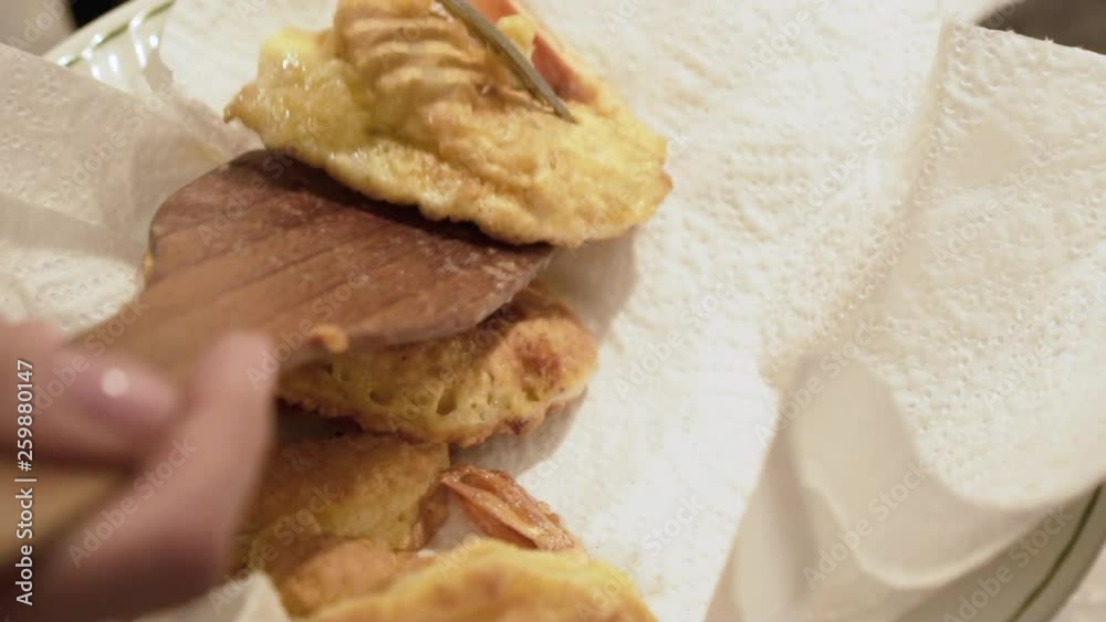 Portion of fried shrimps on a plate with white napkin Portion of fried shrimps on a plate with white napkin