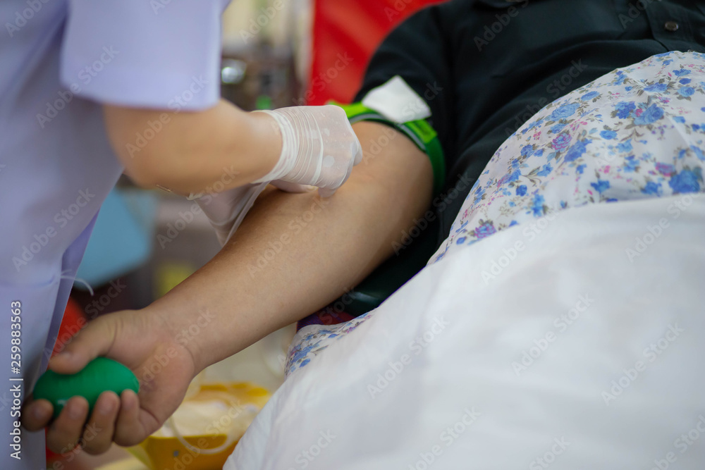 Blood donor at donation with a bouncy ball holding in hand, image for Thai Jan 2019 Blood donor at donation with a bouncy ball holding in hand, image for Thai Jan 2019