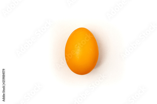 Orange painteded chicken egg isolated on the white background.