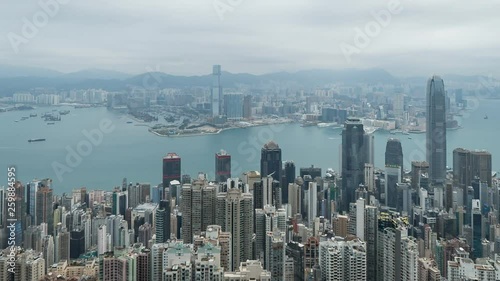 HONG KONG, CHINA - APRIL 2, 2019: 4K Cinematic Zoomed Time Lapse Footage of Victoria Harbour taken from The Peak in Hong Kong during cloudy day.