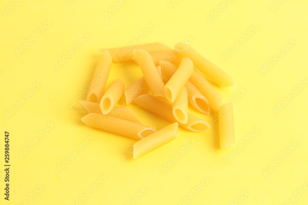 pasta raw feathers on colorful background