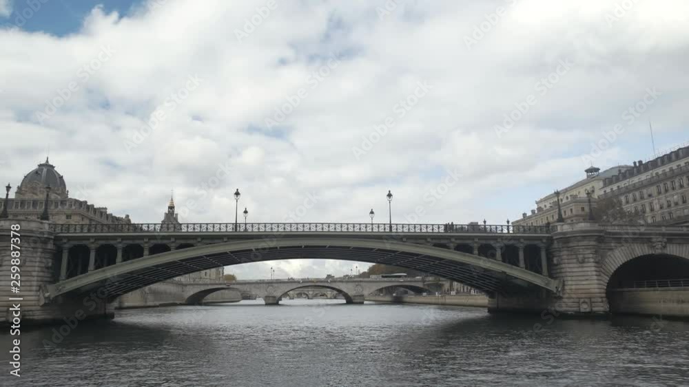 Point of view from a boat cruise tourist on Seine River Bridge of Paris City architecture buildings tour, France Point of view from a boat cruise tourist on Seine River Bridge of Paris City architecture buildings tour, France