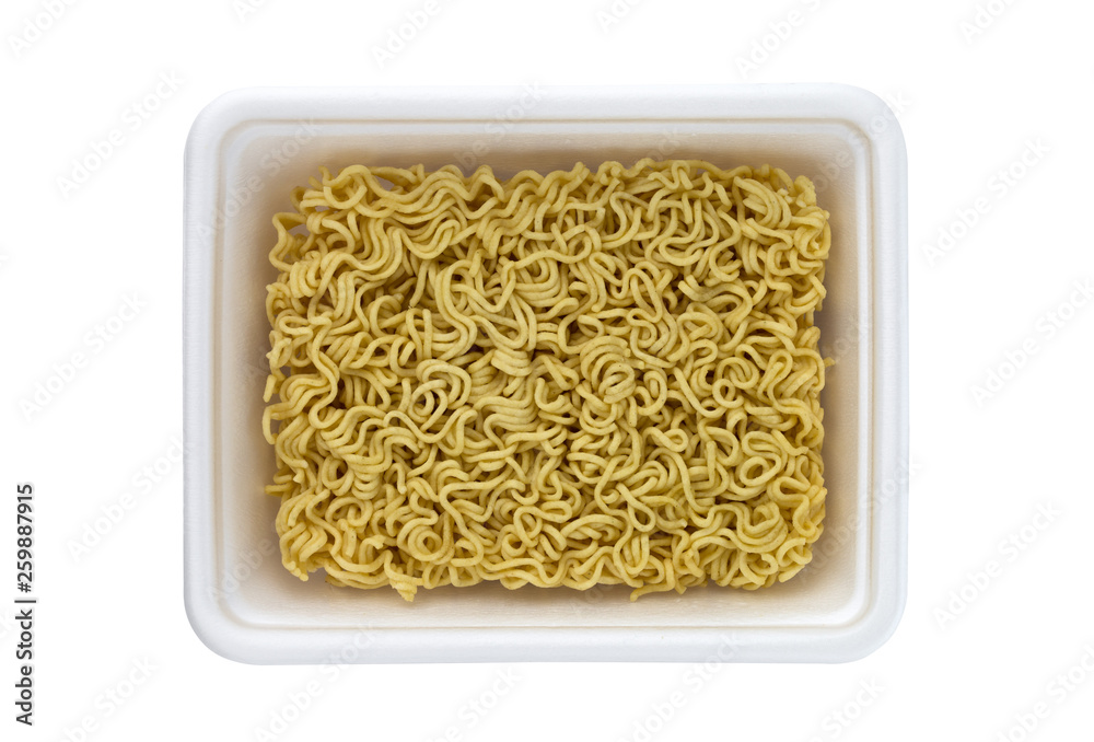 Egg noodles on a white background. Dry egg noodles in a container on a white background. Egg noodles on a white background. Dry egg noodles in a container on a white background.