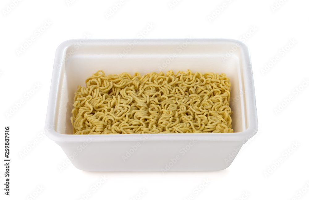 Egg noodles on a white background. Dry egg noodles in a container on a white background.