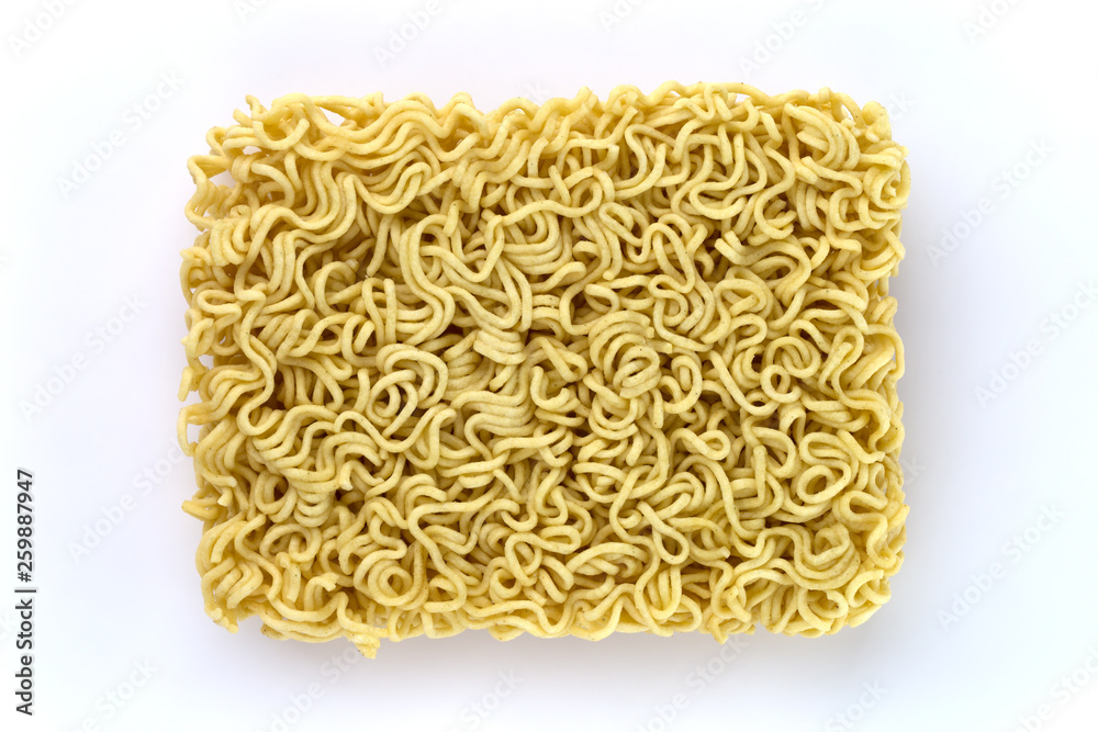 Egg noodles on a white background. Dry egg noodles close up on white background. Egg noodles on a white background. Dry egg noodles close up on white background.