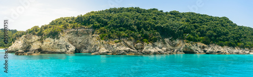 Corfu, Paxos Coast, high cliffs over the blue sea.