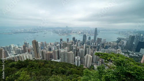 HONG KONG, CHINA - APRIL 2, 2019: 4K Cinematic Time Lapse Footage of Victoria Harbour taken from The Peak in Hong Kong during cloudy day.