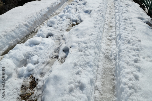 track in melting snow