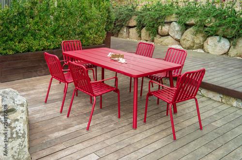 garden dining table with chairs. © alex_dancer