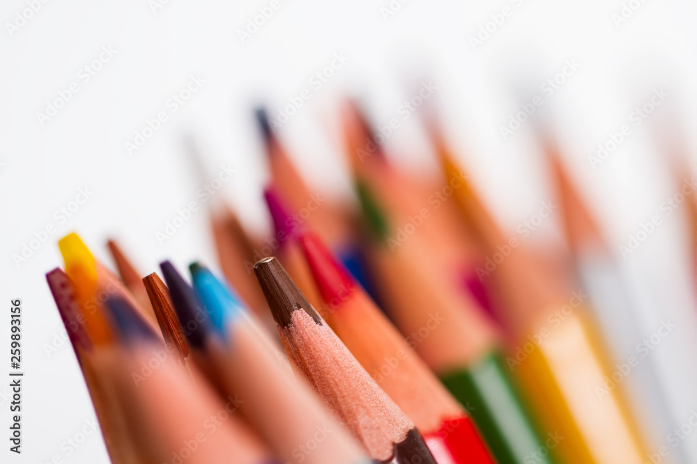 shot of pencils of different colors on a white background, with a small depth of field, macro. shot of pencils of different colors on a white background, with a small depth of field, macro.