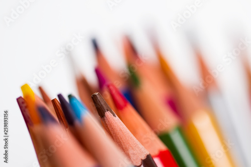 shot of pencils of different colors on a white background, with a small depth of field, macro.