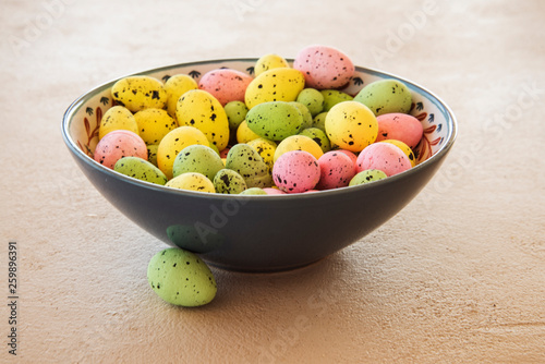 Easter eggs in handmade ceramic dish photo