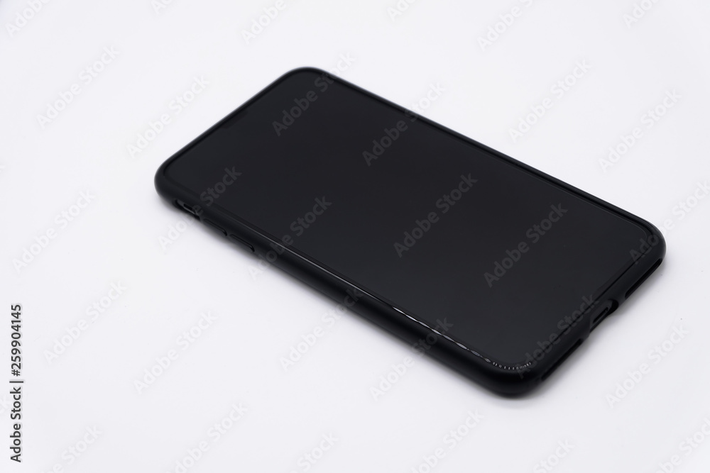 Top view and close up: Big black smart phone isolated on white background Top view and close up: Big black smart phone isolated on white background