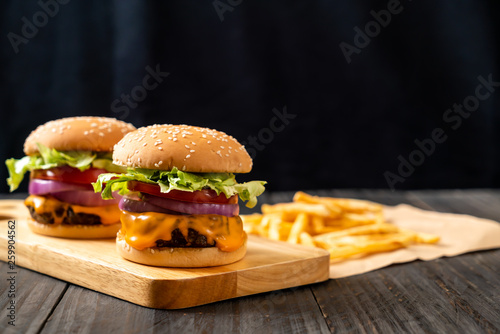 fresh tasty beef burger with cheese and french fries