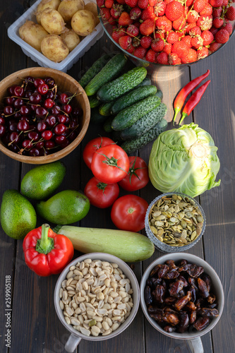 Wallpaper Mural Healthy food. Fish, meat and vegetables. On a dark wooden background. Top view. Torontodigital.ca