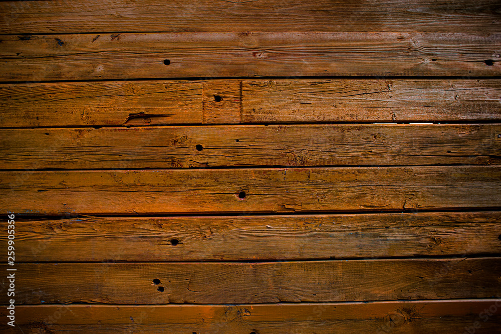 Naklejka premium The wall of wooden planks. Wooden background. The texture of the board. Wood texture