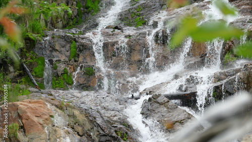 Waterfall among stones and rocks