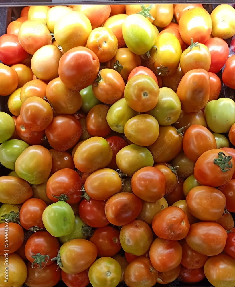 Tomatoes are sold in the market for selling fruits and vegetables.4 Tomatoes are sold in the market for selling fruits and vegetables.4