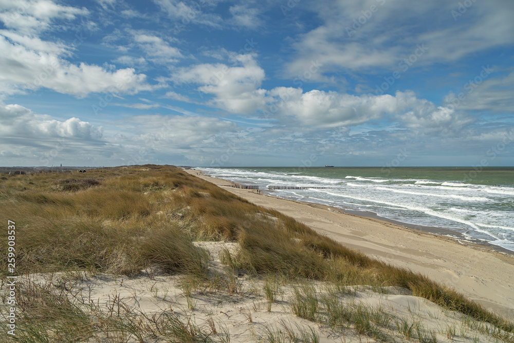 View from Dunes with awesome Sky at springtime to Domburg Beach/ Netherlands