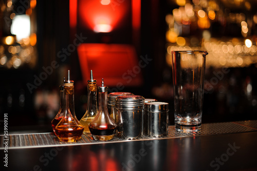 Bartender equipment such as bottles, measuring glass cup and spice shakers