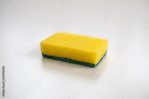 Isolated yellow sponge on the white background