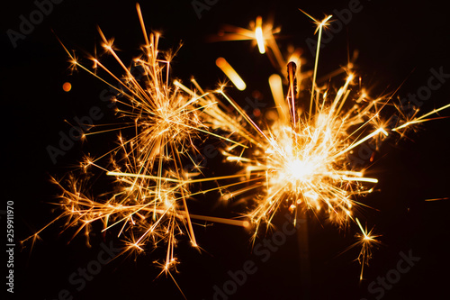 Sparkler background. Christmas and new year sparkler holiday background. © Achira22