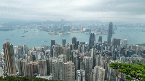 HONG KONG, CHINA - APRIL 2, 2019: 4K Cinematic Zooming In Faster Time Lapse Footage of Victoria Harbour taken from The Peak in Hong Kong during cloudy day.