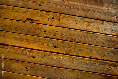 The wall of wooden planks. Wooden background. The texture of the board. Wood texture