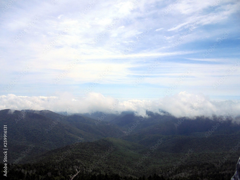 Naklejka premium clouds over the mountains