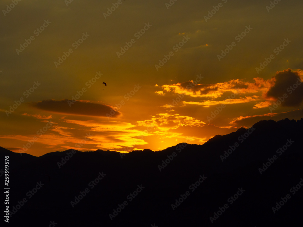 Paragliding orange sunset