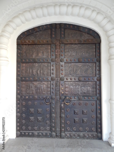Ancient beautiful door, the entrance to the building © HelenkaNNN