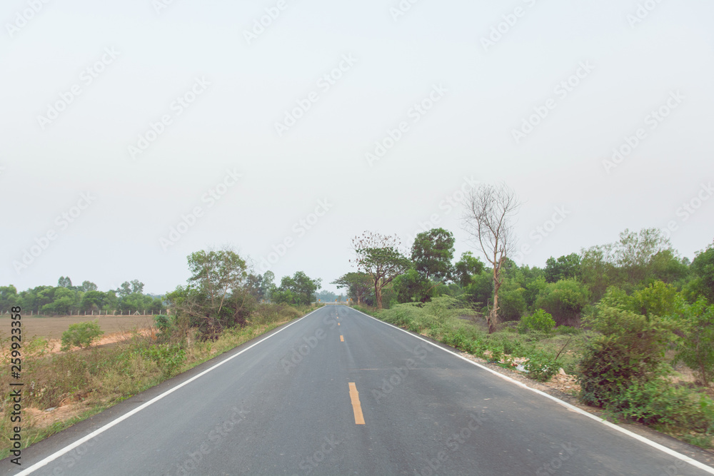 Empty asphalt road and clean blue sky in summer day background with copy space