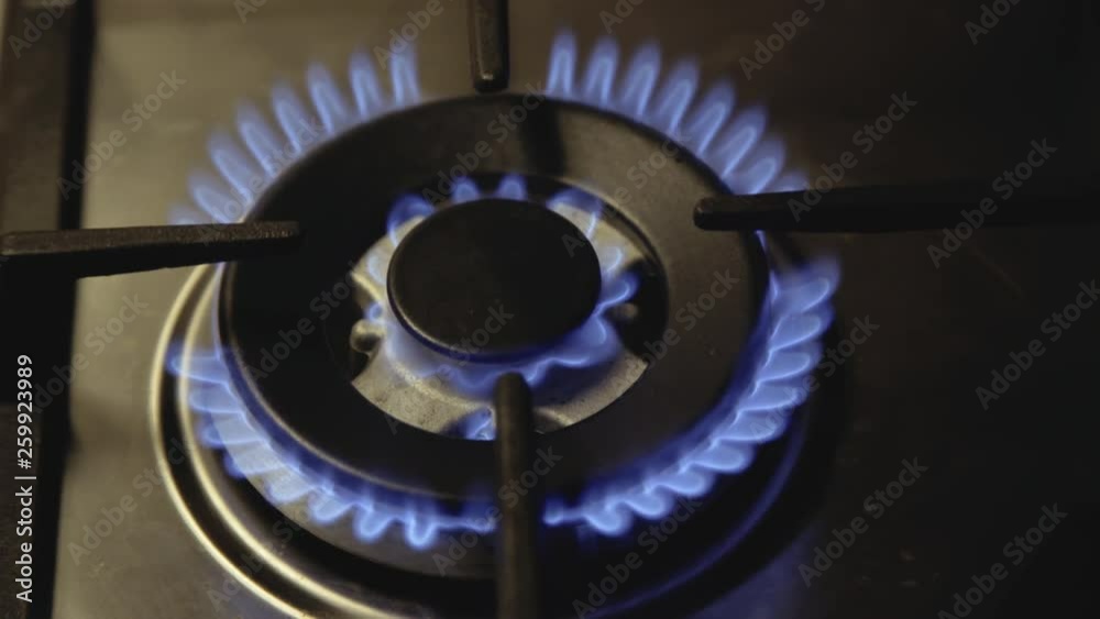 Background of flaming hotplate on stove top. Fast igniting. Close view Background of flaming hotplate on stove top. Fast igniting. Close view